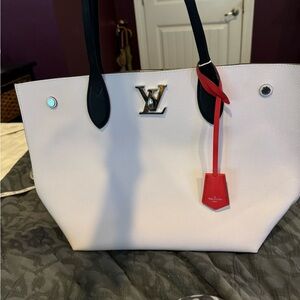 Louis Vuitton medium Lock me silver tote.  Off white and black.  Red toggle